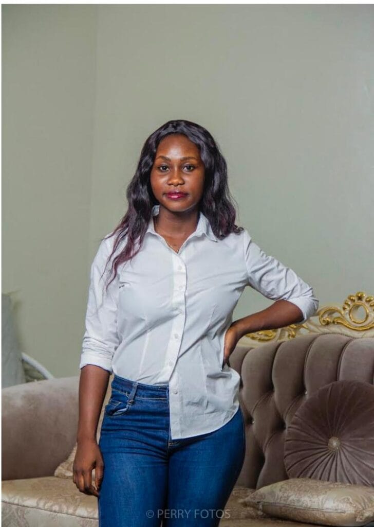 picture of Joyce Agyeiwaa in a white long sleeves and a jeans trouser.