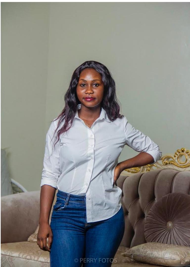 picture of Joyce Agyeiwaa in a white long sleeves and a jeans trouser.