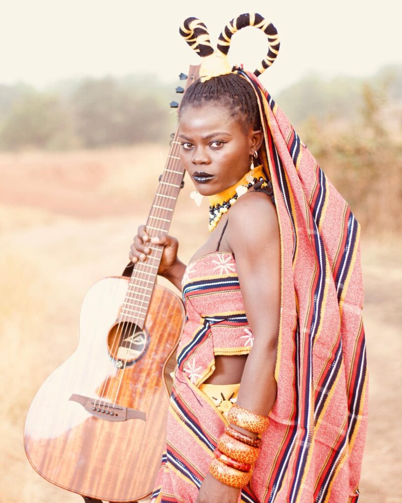 Picture of a Ghanaian singer Wiyaala rocking smock in Ghanaian fashion style.