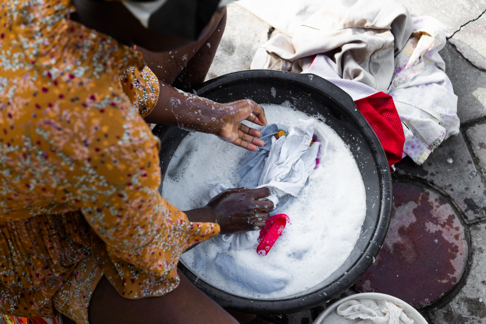 Close-up African woman washing clothes.