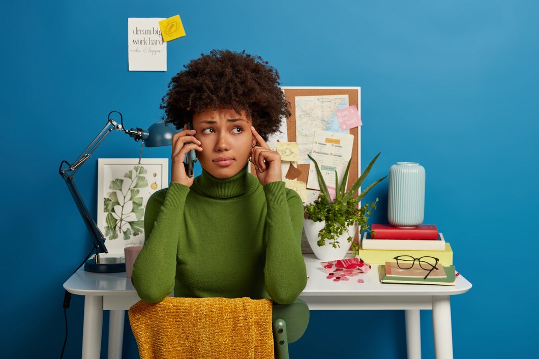 Picture of a black woman thinking, signifying growth vs fixed mindset