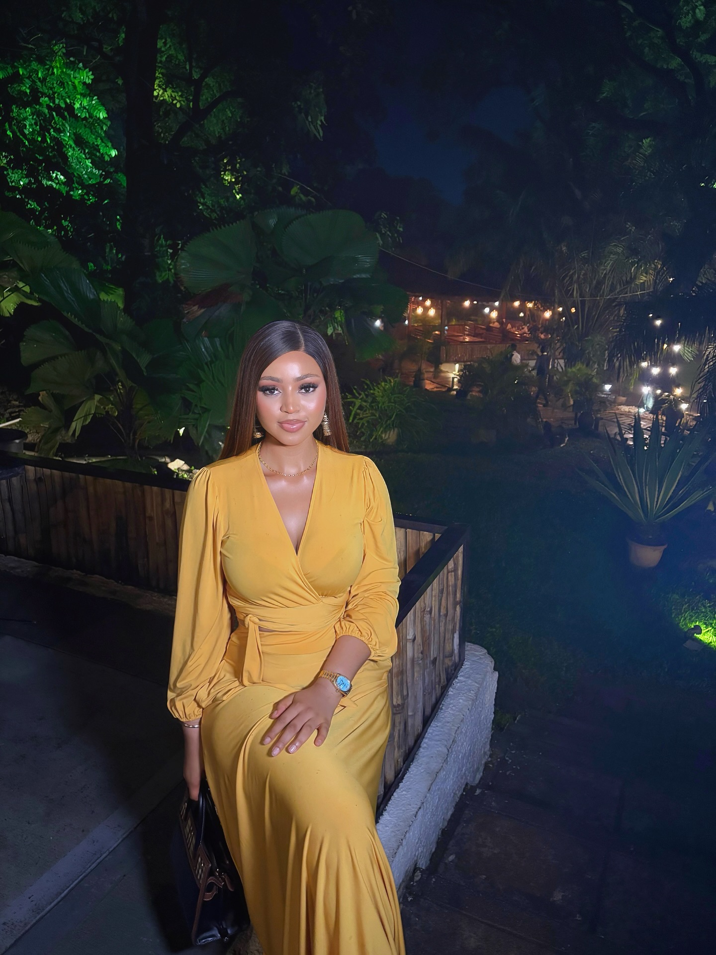 Picture of Regina Daniels in a yellow dress.