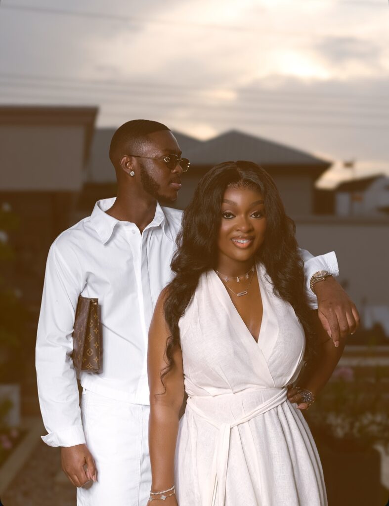 A picture of Ghanaian actress Jackie Appiah and son in a white outfits. Jackie Appiah's lifestyle habits.