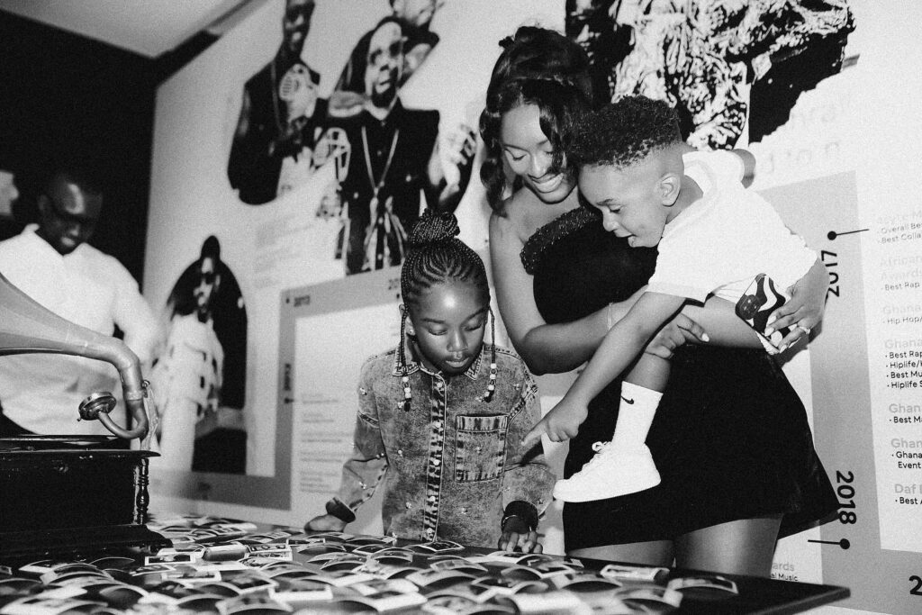 A picture of Ghanaian celebrity Sarkodie's family sharing a quiet moment, showing love beyond fame.