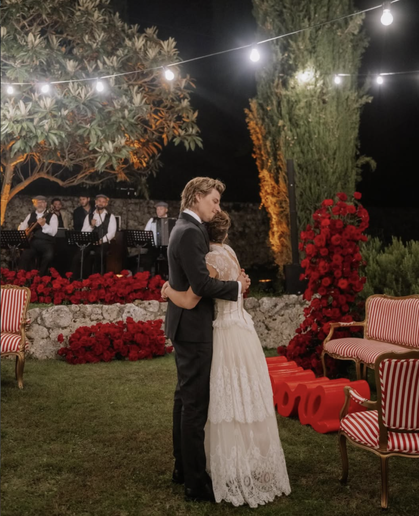 Millie Bobby Brown sharing a quiet wedding moment with her husband, romantic outdoor setting