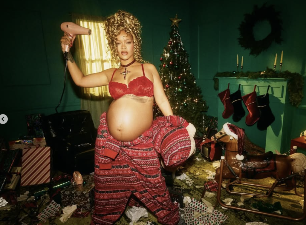 Rihanna pregnant in red lingerie holding a hair dryer, bold maternity fashion moment showing confidence and identity during motherhood journey