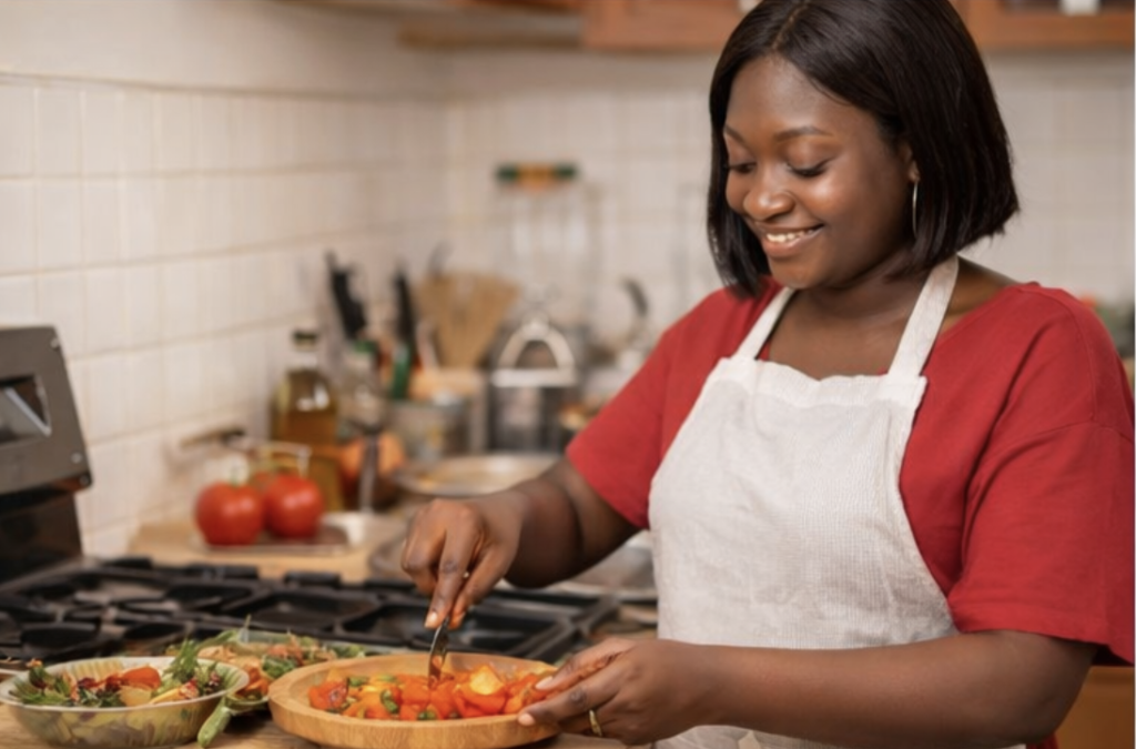 Woman storing home cooked meals in refrigerator after preparing food for the family