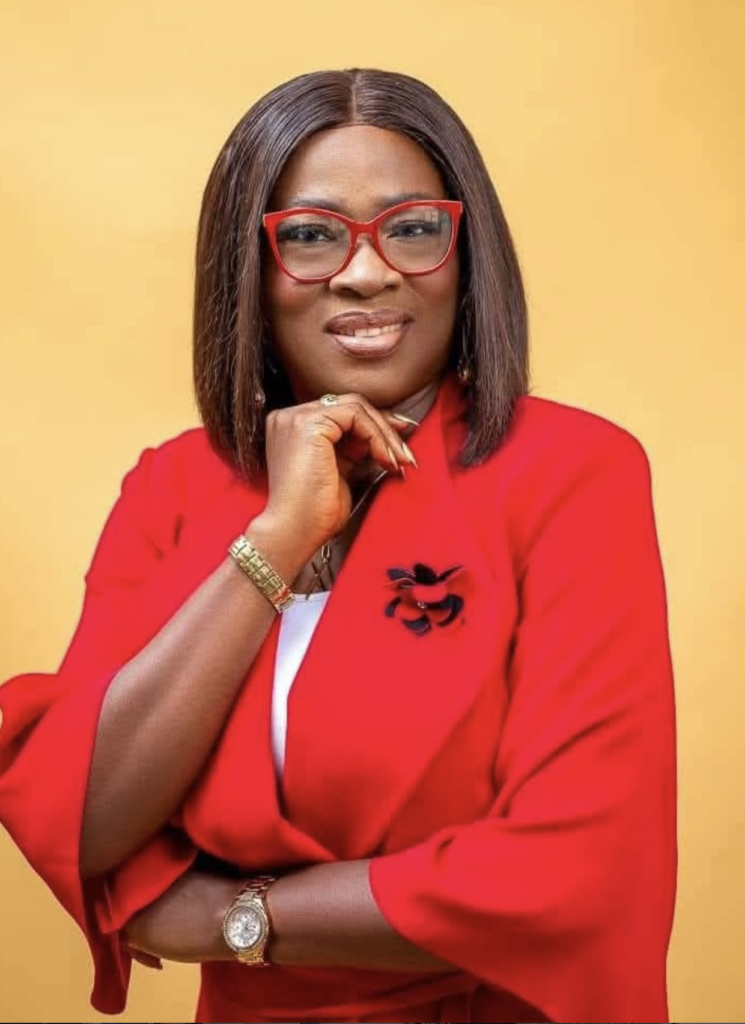 Portrait of Mama Cathy smiling confidently about contribution in marriage