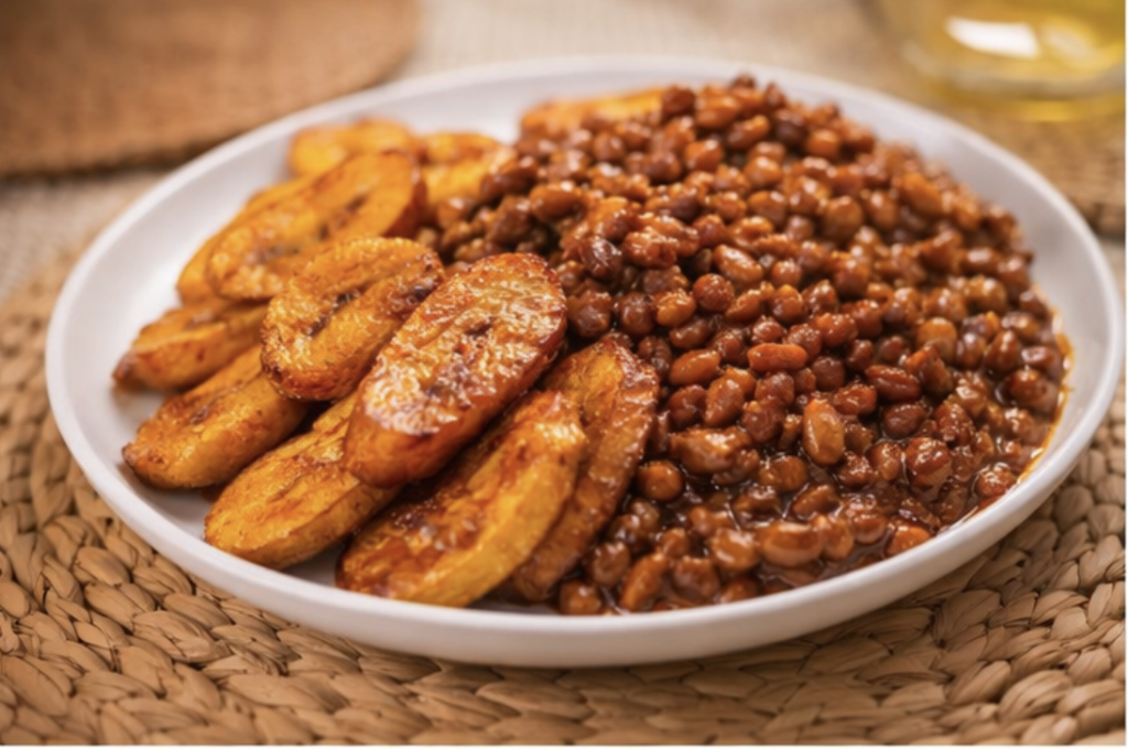 Fried ripe plantain served with beans stew, a traditional Ghanaian meal that reminds me of my childhood