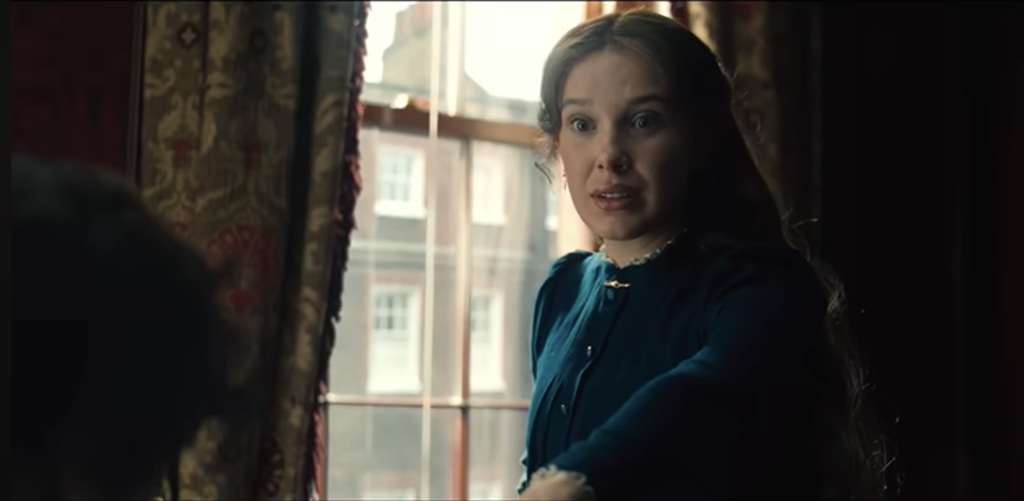 Enola Holmes reacts with surprise during an emotional moment in Enola Holmes 3.